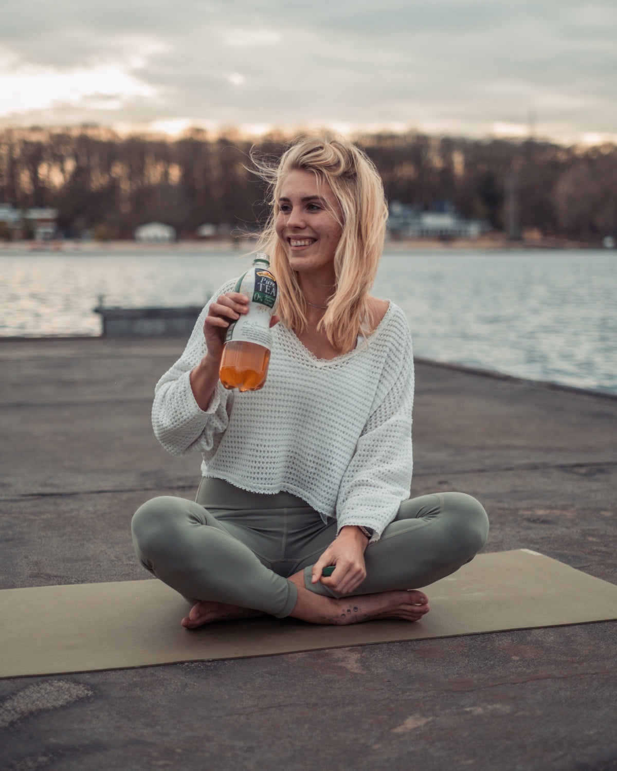 Doing yoga by the lake